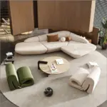 ⁦أريكة فاخرة منحنية بتصميم فني أنيق⁩ - الصورة ⁦3⁩